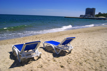 Fototapeta na wymiar Chaise longue, sunbed for sunbathing, summer beach