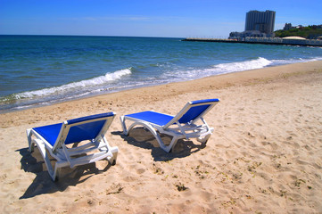 Chaise longue, sunbed for sunbathing, summer beach