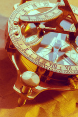 Fototapeta na wymiar antique compass on vintage paper background