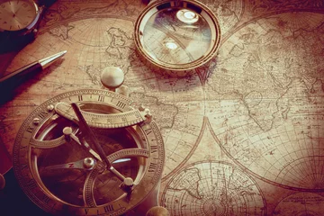 Fotobehang Old vintage compass and travel instruments on ancient map © fotofabrika