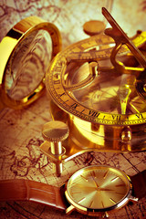 Fototapeta na wymiar Old vintage compass and travel instruments on ancient map
