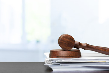judge hammer on white paper and table