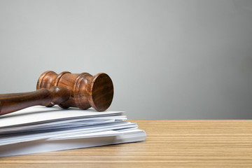 judge hammer on white paper and table