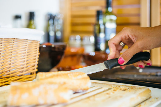 Hand slicing a bread