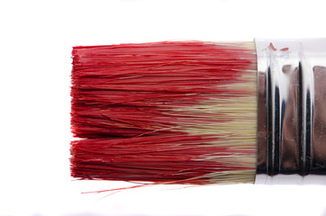 Red brush in red paint