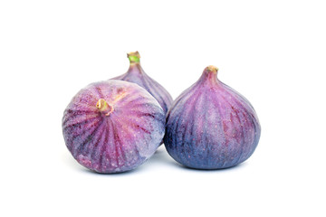 Obraz premium Purple Figs Fruit and Green Leaves. Organic Food on White Background