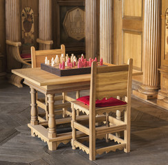 Wooden chess table with charis