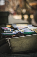Bottles of wine in the wooden box at the street