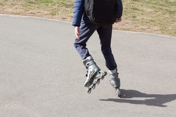 the person rides roller skates in the park