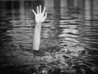 Drowning victims, Hand of drowning man needing help. Failure and rescue concept.