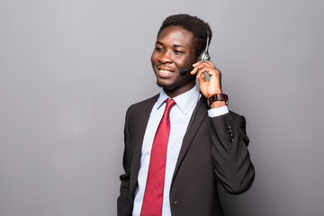 Closeup portrait of a young male customer service representative or call centre worker or operator,...