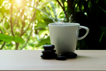 stack of pebbles and coffee cup.