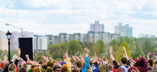 people dancing hands up outdoors