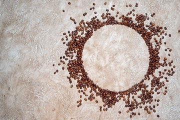 Circle frame of coffee beans with plenty of copy space for your text inside the circle and at the side