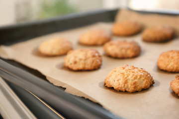 Baking tray with delicious coconut macaroons, closeup