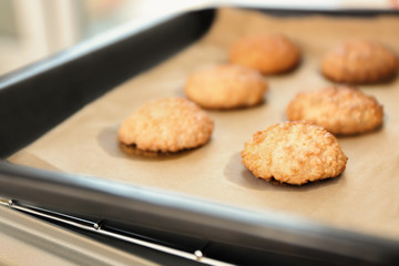 Baking tray with delicious coconut macaroons, closeup