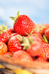 Selective focus on fresh red strawberry with blurred background.