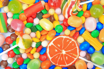 Fototapeta na wymiar Lollipops and colorful candies, closeup