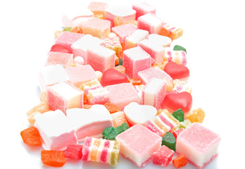 Tasty and colorful jelly candies on white background