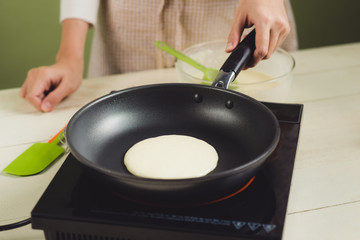 House wife wearing apron making. Steps of making cooking pancake.