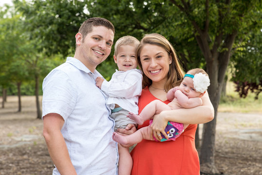 Young Millennial Family Outside