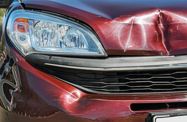 Car with smashed hood after accident, closeup