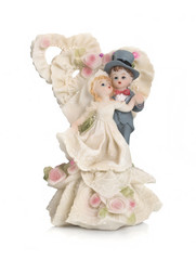Bride and groom, old cake topper on white background