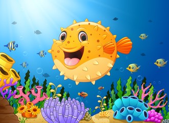 Naklejka na ściany i meble Cartoon puffer fish with sea life 