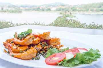 Shrimp baked with pepper on table