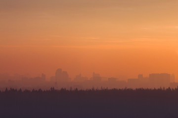 Silhouette of  city at sunrise