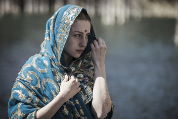 The girl poses in the Indian sari