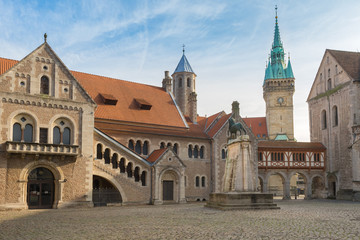 Fototapeta na wymiar Medival Burgplatz with Braunschweiger Löwe, Burg Dankwarderode and City Hall tower, Braunschweig Germany