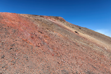 Red rocks of Etna - tallest active volcano in Europe. Sicily, Italy