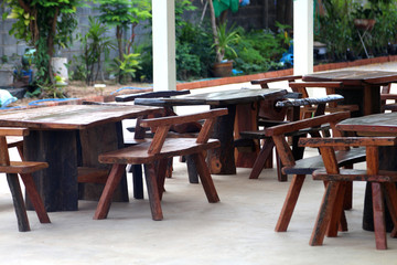 Table and wooden chairs are in store.