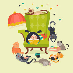 Fototapeta premium Girl reading book to cats