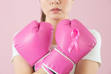 Chinese girl wear boxing gloves crossed arms