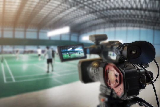 
* Description/Title/Caption: 
Video camera taking video at badminton court
