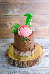 chocolate cream cake with chocolate peony and isomalt decoration