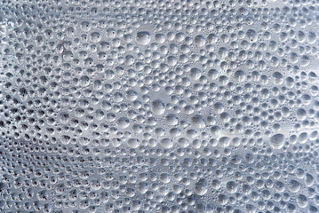 Condensation drops dew on bottle