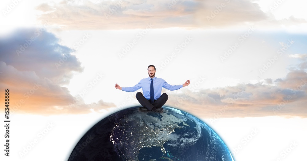 Poster Businessman meditating on globe against sky