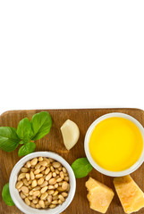 pesto ingredients on wooden surface