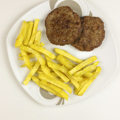 Hamburgers in a plate on white background - top view