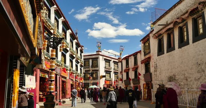 Oct 22,2016-china:4k tibetan & tourist walking on famous barkhor street in lhasa,tibet,butter store.