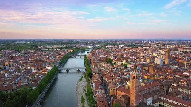 aerial view of verona city center flying forwards at dawn