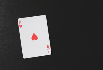 Ace of hearts on a black background, playing cards, copyspace for you marketing text horizontal photo