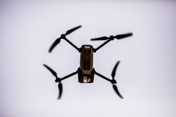 Quadrocopters with camera during flight in the sky