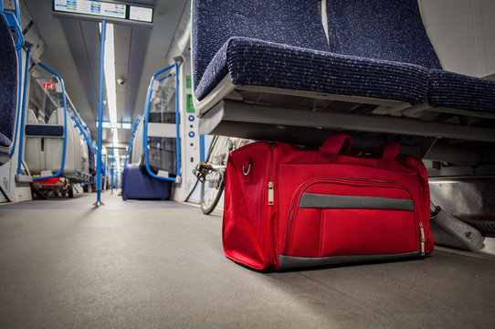 Terrorism and public safety concept with unattended bag left in a subway cart, train carriage or monorail. Travelers should report suspicious items to the police or security staff with copy space