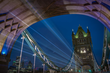 Fototapeta na wymiar Light trails and traffic on Tower bridge at night in London, England, UK