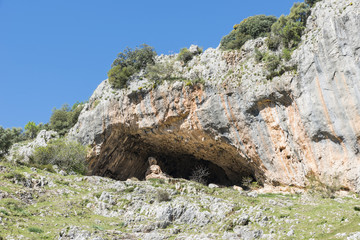 rocks with caves and blue sky in andalusia
