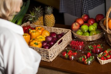 Various types of fruits and vegetables at counter